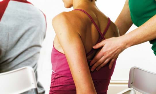 How do we treat low back strains and sprains with manual therapy?